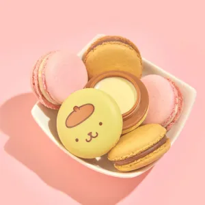 The Crème Shop x Hello Kitty - Pompompurin Holiday Caramel Pudding Macaron Lip Balm